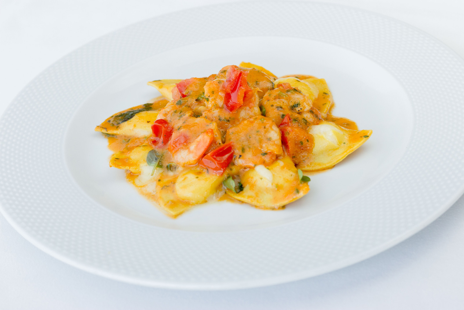 Mezzaluna di Branzino com salsa de gamberi